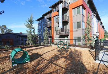 our apartments have a fenced in play area with playground equipment